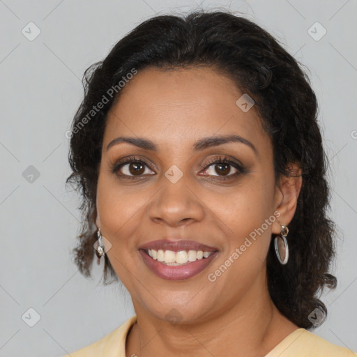 Joyful black young-adult female with medium  brown hair and brown eyes