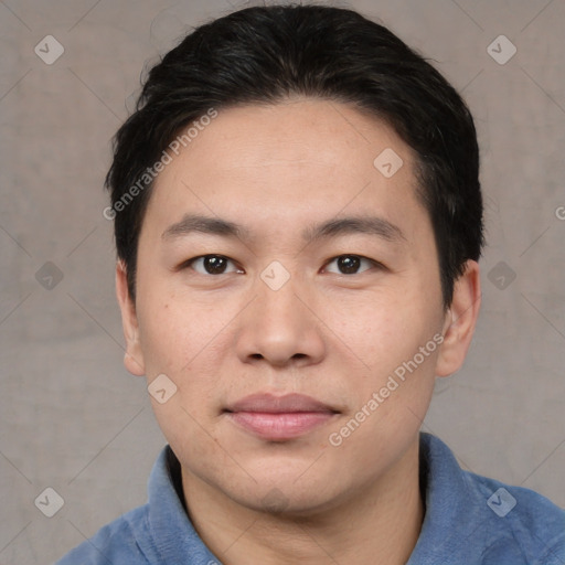 Joyful asian young-adult male with short  black hair and brown eyes