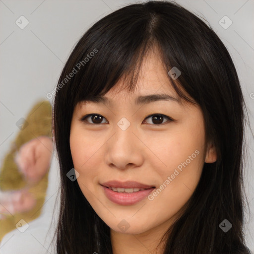 Joyful asian young-adult female with long  brown hair and brown eyes