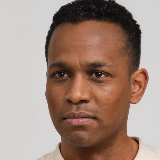 Neutral black young-adult male with short  black hair and brown eyes