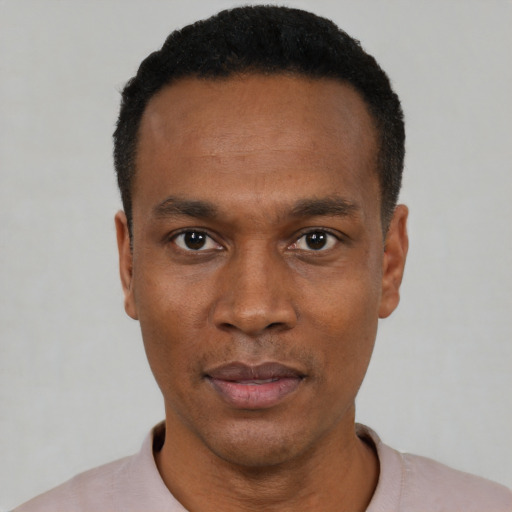 Neutral black young-adult male with short  black hair and brown eyes