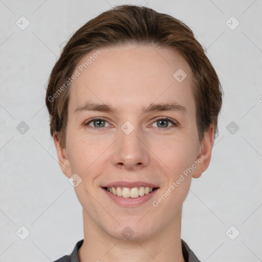 Joyful white young-adult female with short  brown hair and grey eyes