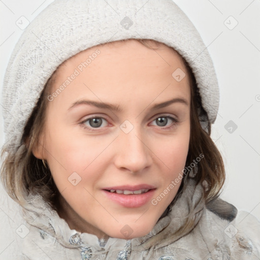 Joyful white young-adult female with medium  brown hair and blue eyes