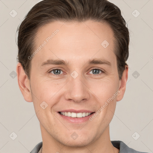 Joyful white young-adult male with short  brown hair and grey eyes