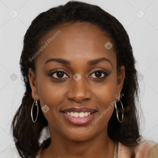 Joyful black young-adult female with long  brown hair and brown eyes