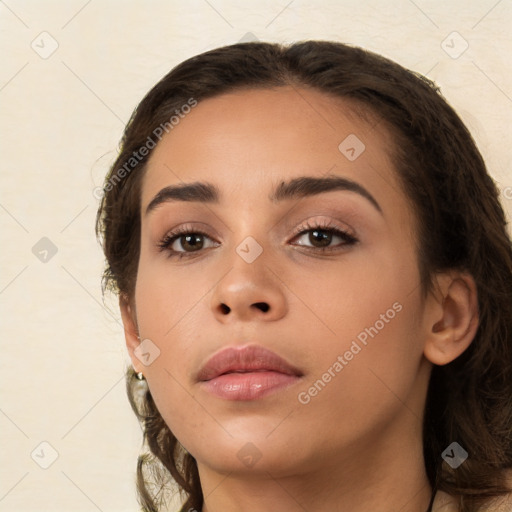 Neutral white young-adult female with long  brown hair and brown eyes