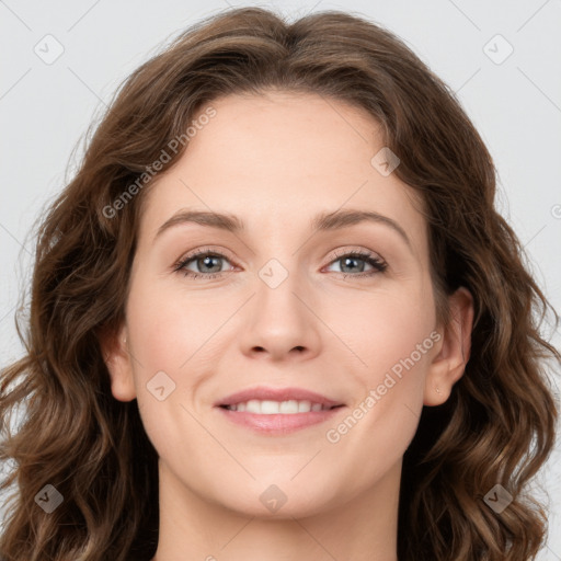 Joyful white young-adult female with long  brown hair and green eyes