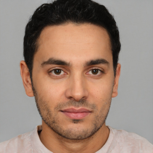 Neutral white young-adult male with short  black hair and brown eyes