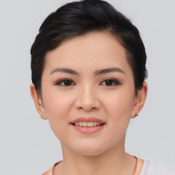 Joyful asian young-adult female with short  brown hair and brown eyes