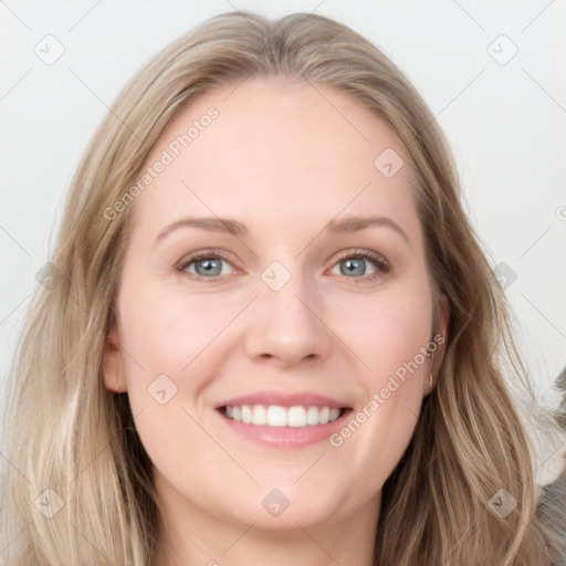 Joyful white young-adult female with long  brown hair and blue eyes