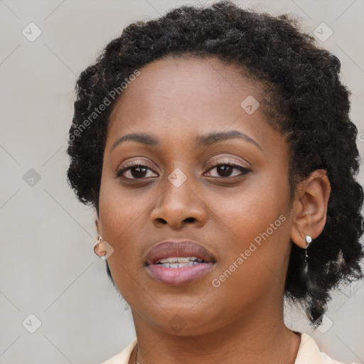 Joyful black young-adult female with medium  black hair and brown eyes