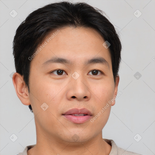 Joyful asian young-adult male with short  brown hair and brown eyes