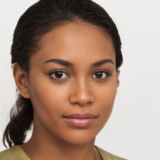 Joyful latino young-adult female with medium  brown hair and brown eyes