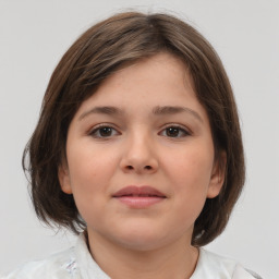 Joyful white child female with medium  brown hair and brown eyes