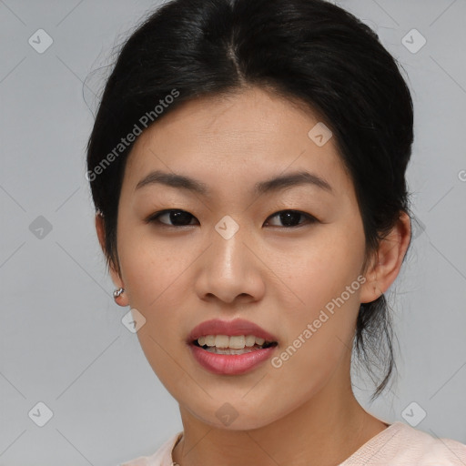 Joyful asian young-adult female with medium  black hair and brown eyes