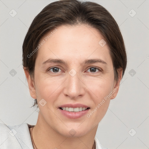 Joyful white adult female with short  brown hair and brown eyes