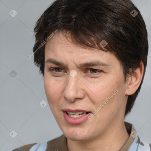 Joyful white adult female with medium  brown hair and brown eyes