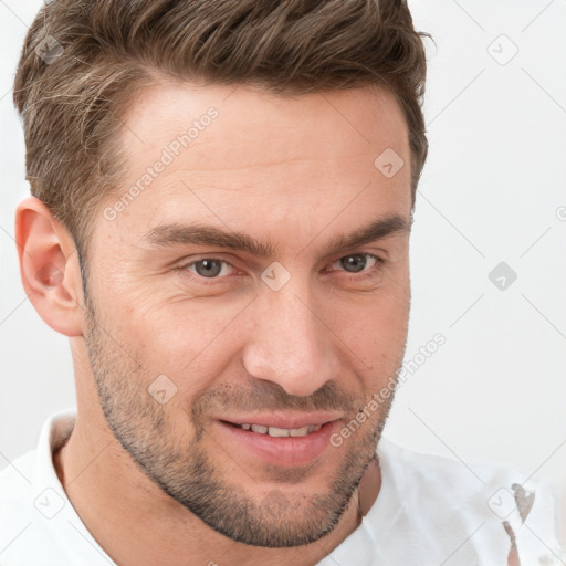 Joyful white adult male with short  brown hair and brown eyes