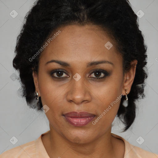 Joyful black adult female with medium  brown hair and brown eyes