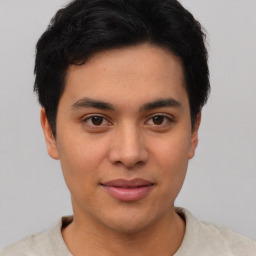 Joyful asian young-adult male with short  black hair and brown eyes