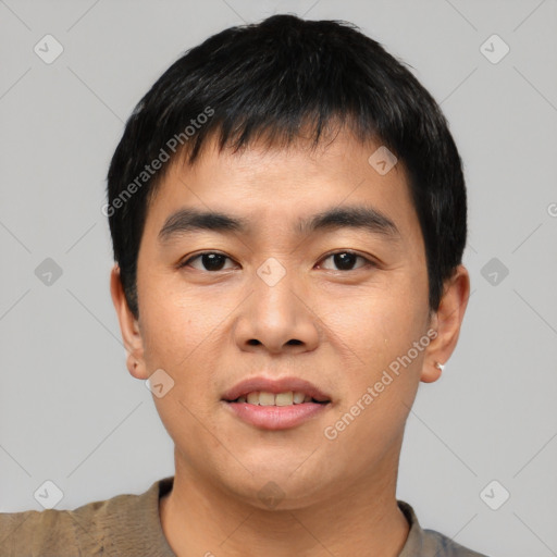 Joyful asian young-adult male with short  black hair and brown eyes