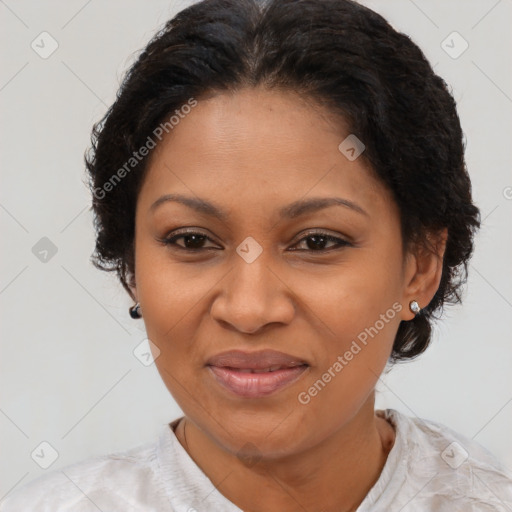 Joyful black adult female with medium  brown hair and brown eyes