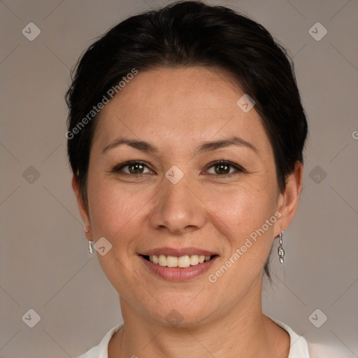 Joyful white adult female with short  brown hair and brown eyes