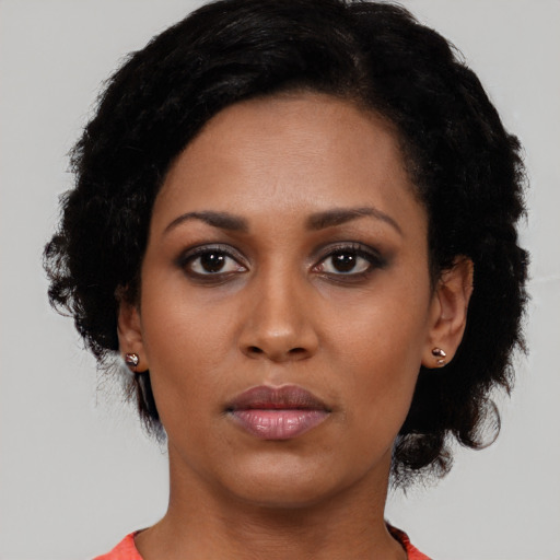 Neutral latino young-adult female with short  black hair and brown eyes