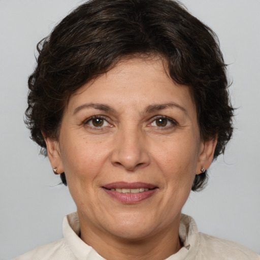 Joyful white adult female with medium  brown hair and brown eyes