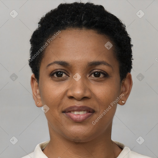 Joyful black young-adult female with short  black hair and brown eyes