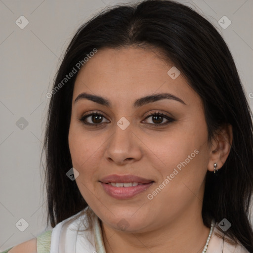 Joyful latino young-adult female with long  brown hair and brown eyes