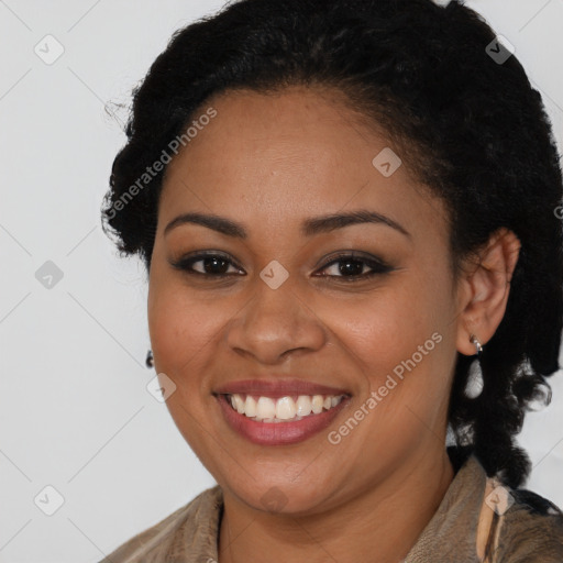 Joyful black young-adult female with long  brown hair and brown eyes