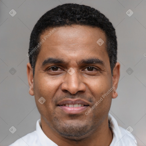 Joyful latino adult male with short  black hair and brown eyes