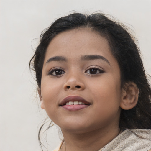 Joyful latino child female with medium  brown hair and brown eyes