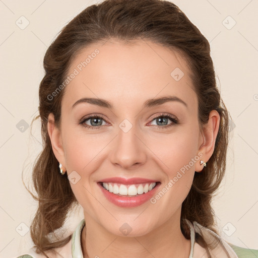 Joyful white young-adult female with medium  brown hair and green eyes