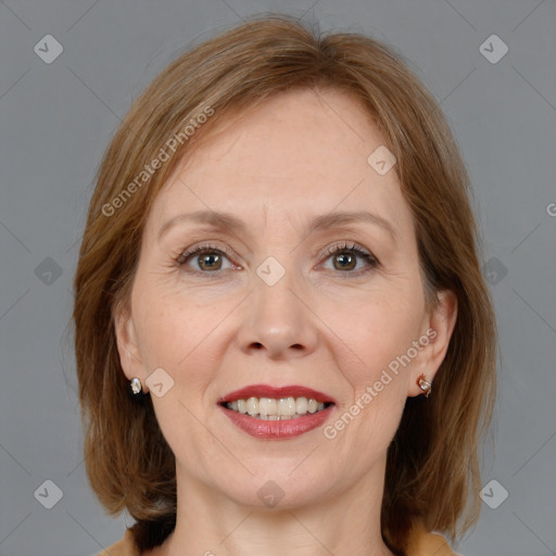 Joyful white adult female with medium  brown hair and brown eyes