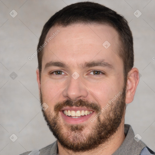 Joyful white young-adult male with short  brown hair and brown eyes