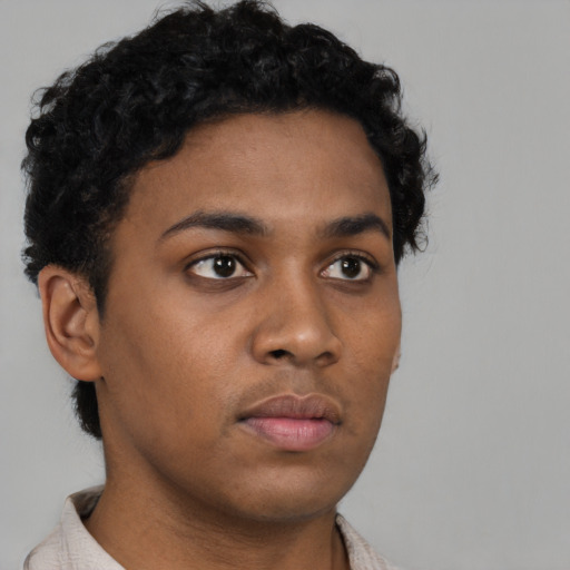 Neutral black young-adult male with short  brown hair and brown eyes
