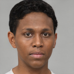 Neutral black young-adult male with short  brown hair and brown eyes