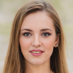 Joyful white young-adult female with long  brown hair and green eyes