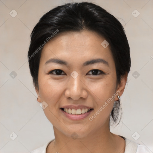 Joyful asian young-adult female with medium  black hair and brown eyes