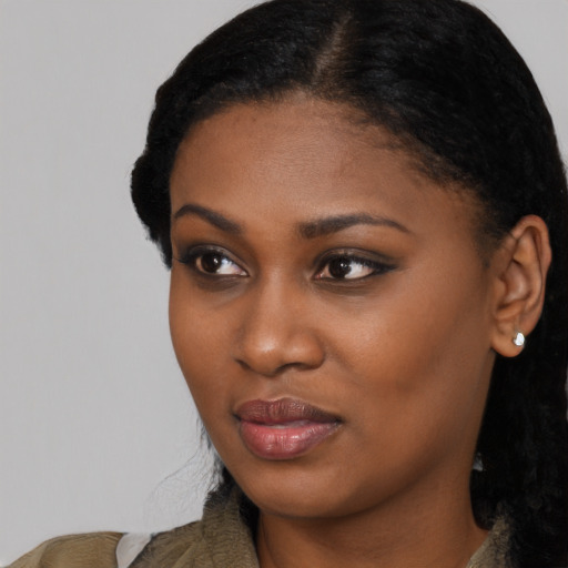 Neutral black young-adult female with medium  black hair and brown eyes