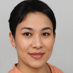 Joyful asian young-adult female with short  black hair and brown eyes