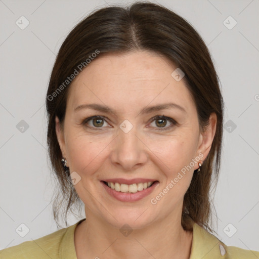 Joyful white adult female with medium  brown hair and brown eyes