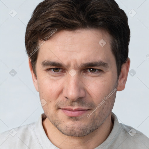 Joyful white adult male with short  brown hair and brown eyes