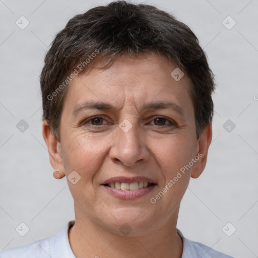 Joyful white adult female with short  brown hair and brown eyes