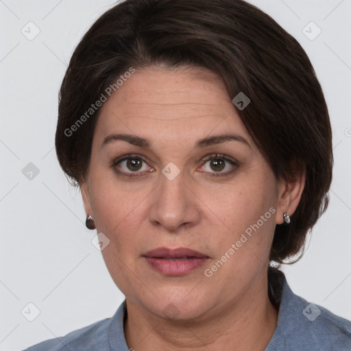 Joyful white adult female with medium  brown hair and grey eyes