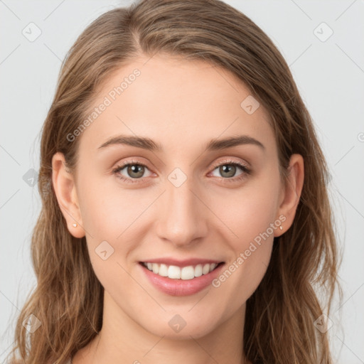 Joyful white young-adult female with long  brown hair and green eyes