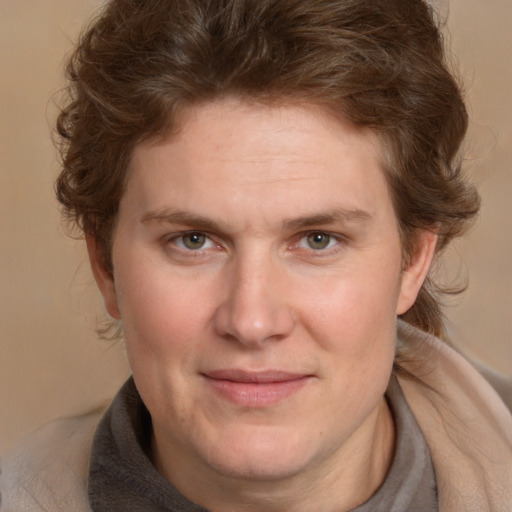 Joyful white young-adult male with medium  brown hair and brown eyes