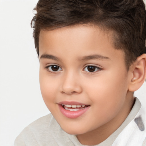 Joyful white child male with short  brown hair and brown eyes